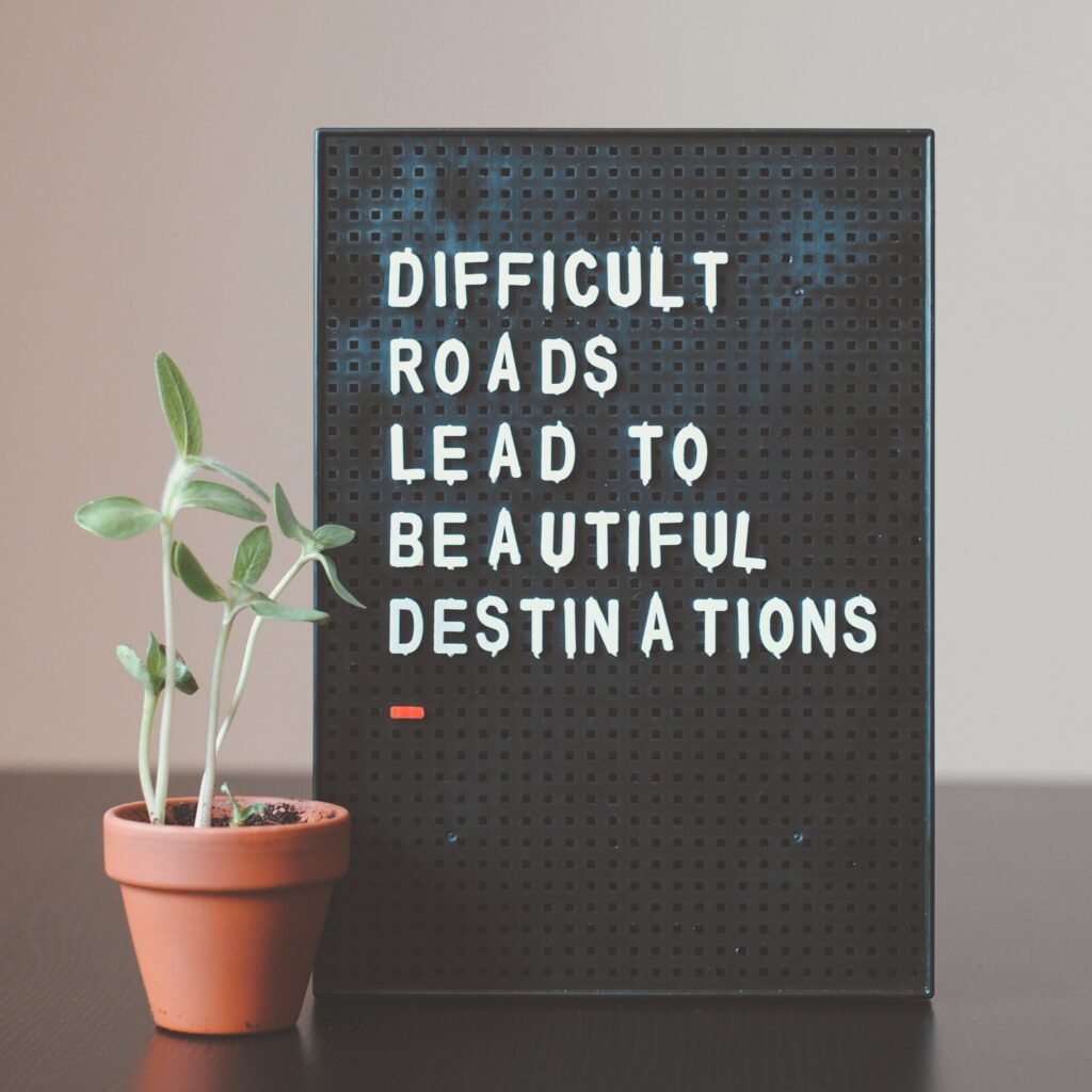 difficult roads lead to beautiful destinations sign 