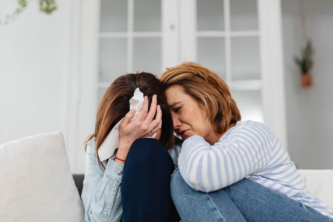 Two women crying